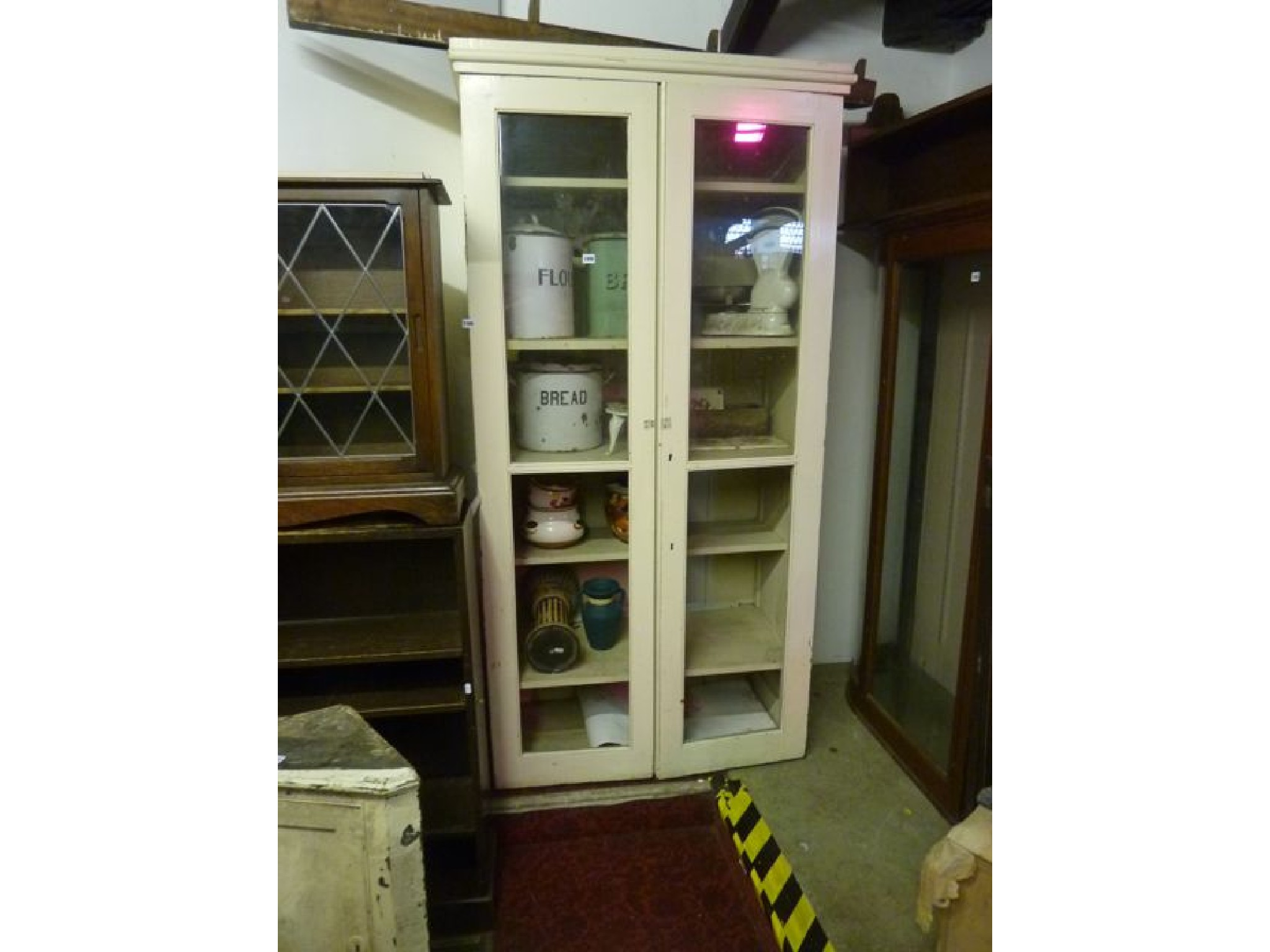 A 19th century painted pine and freestanding kitchen cabinet enclosed