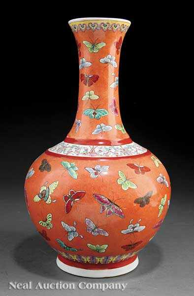 A Chinese Famille Rose Coral Ground Porcelain 100 Butterfly Bottle