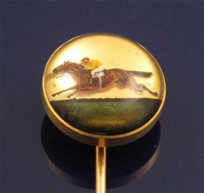 A 19th Century gold stick pin mounted with a reverse