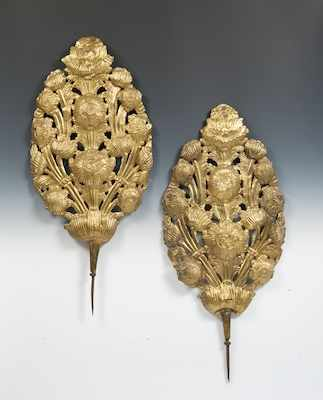 A Pair of Gilt Repousse Flame Shields A northern European