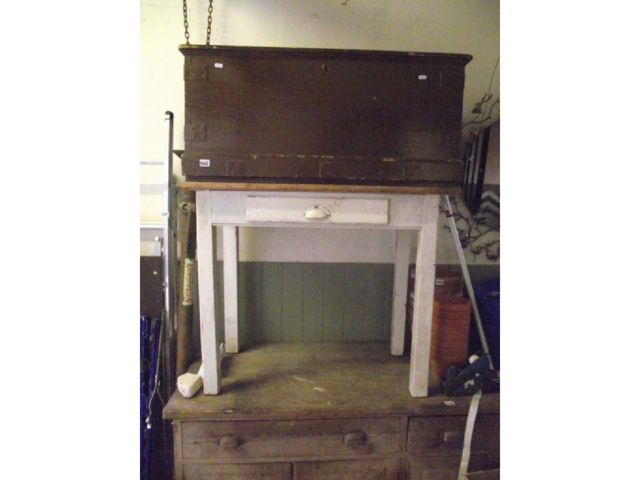 A small vintage pine kitchen table with rectangular stained top