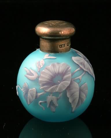 Floral design in white mauve on pale blue silver screw
