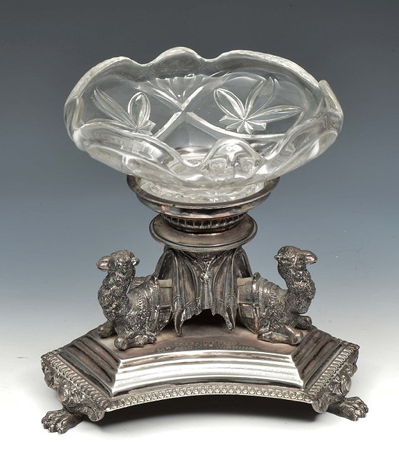 A SILVER PLATED CENTREPIECE by Walker Hall of triform form
