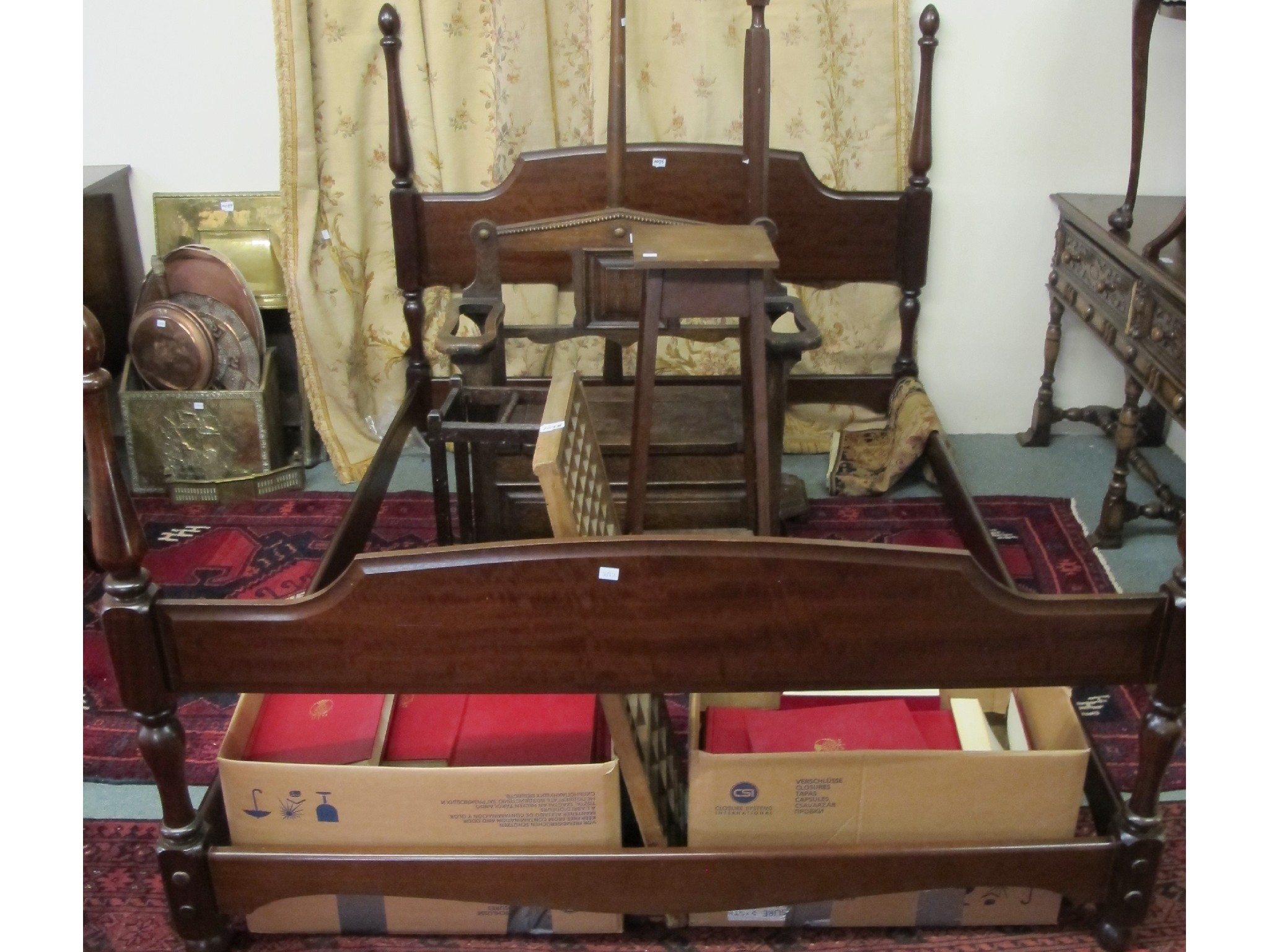 A Stag mahogany double bed four poster surround