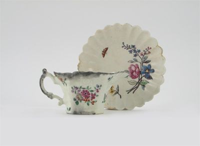 A Chelsea fluted saucer painted with a butterfly and a