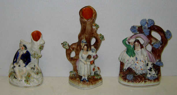 THREE STAFFORDSHIRE POTTERY FGURE GROUPS Two miniature spill vases with