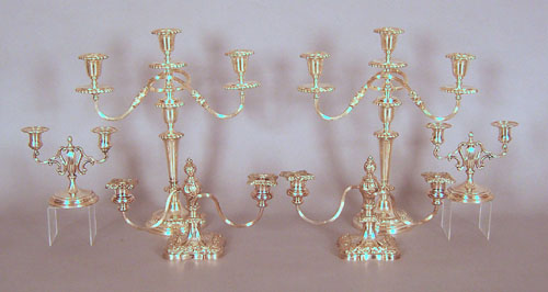 Two pair of silver plated candelabra 16 h and 7