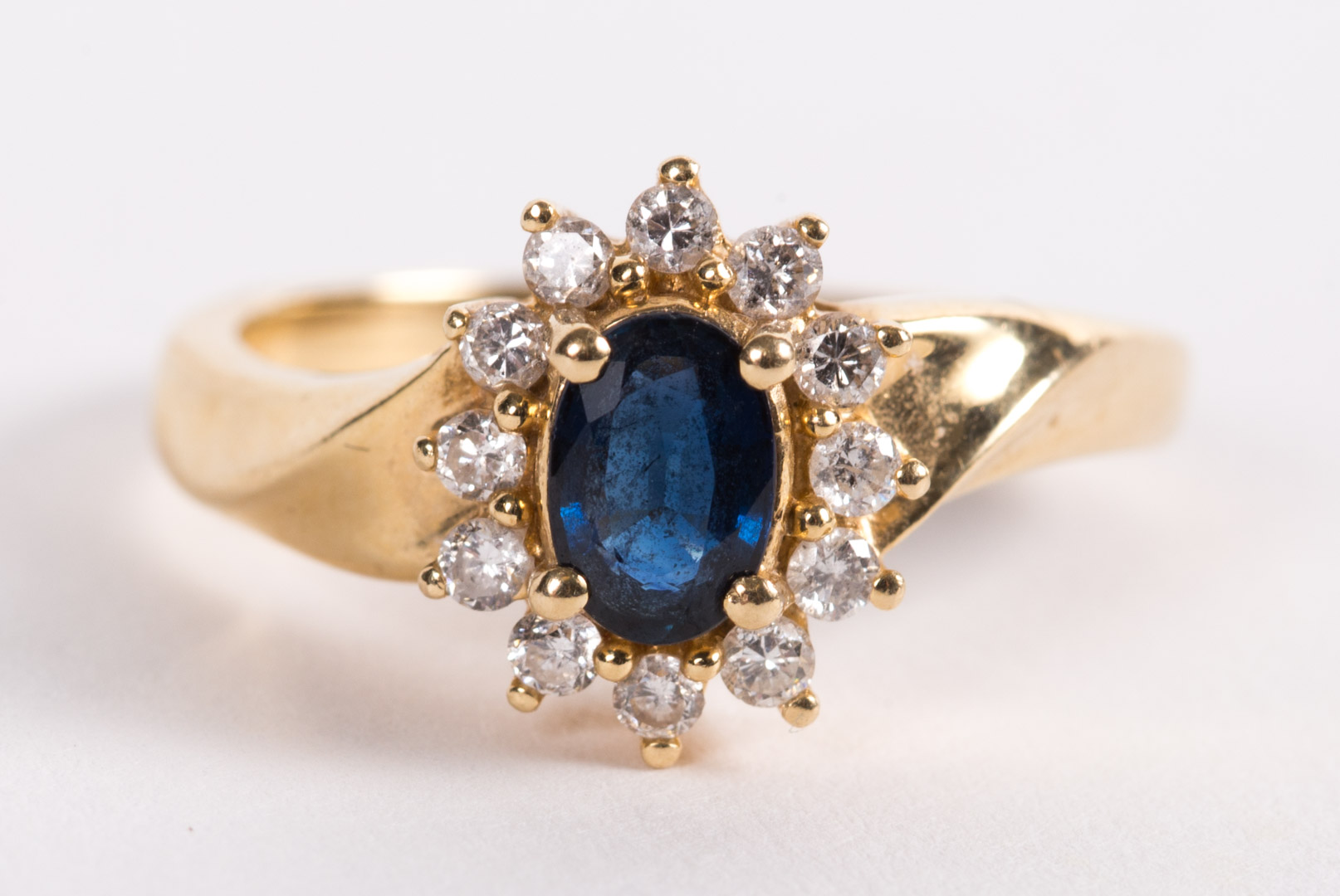 A Sapphire and Diamond Ring center oval sapphire approximately 0