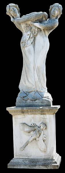 An Art Nouveau cast stone figural group on pedestal Depicting