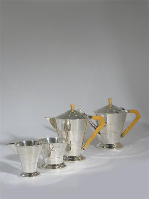 An Edward Viners silver and ivory four piece tea set