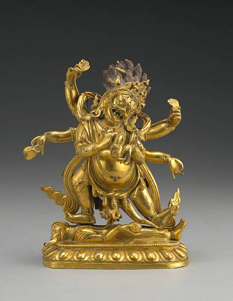 A fine Sino Tibetan gilt bronze figure of Mahakala 18th