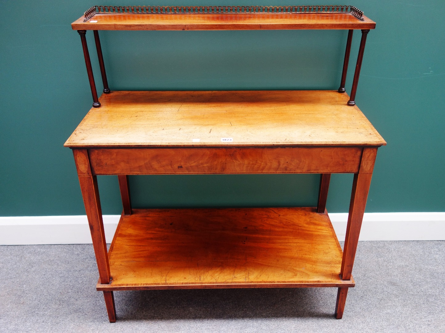 An inlaid mahogany side table the open shelf back over