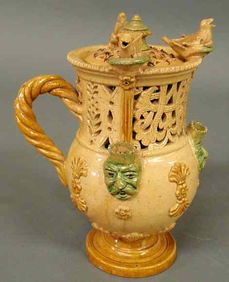 Glazed ceramic puzzle jug with lid 19th c decorated with