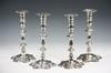 CANDLESTICKS Set of 4 matching Irish silver candlesticks with petal