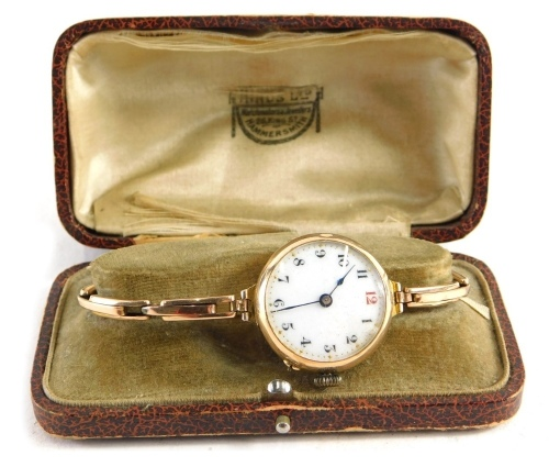 An early 20thC wristwatch with 3cm diameter Arabic enamel dial