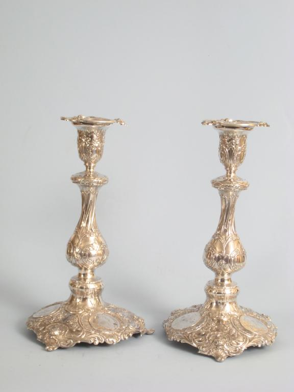Pair of German Candlesticks on baluster columns scroll embossed circular