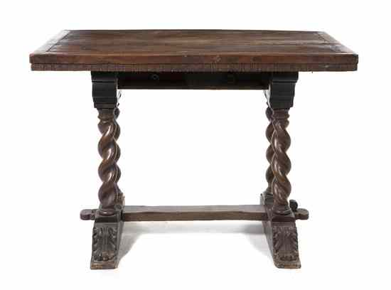 A Renaissance Revival Trestle Table having a rectangular top raised