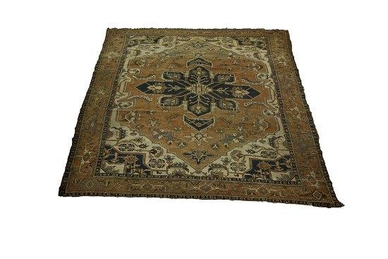 A Heriz carpet from North West Persia the brick red