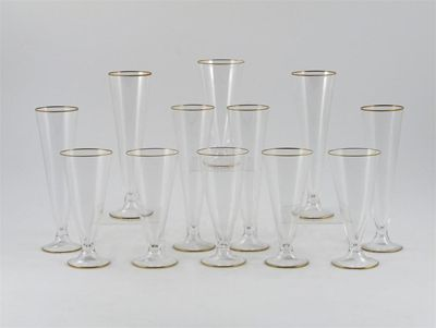 Twelve Carlo Moretti glass flutes six tall six short with