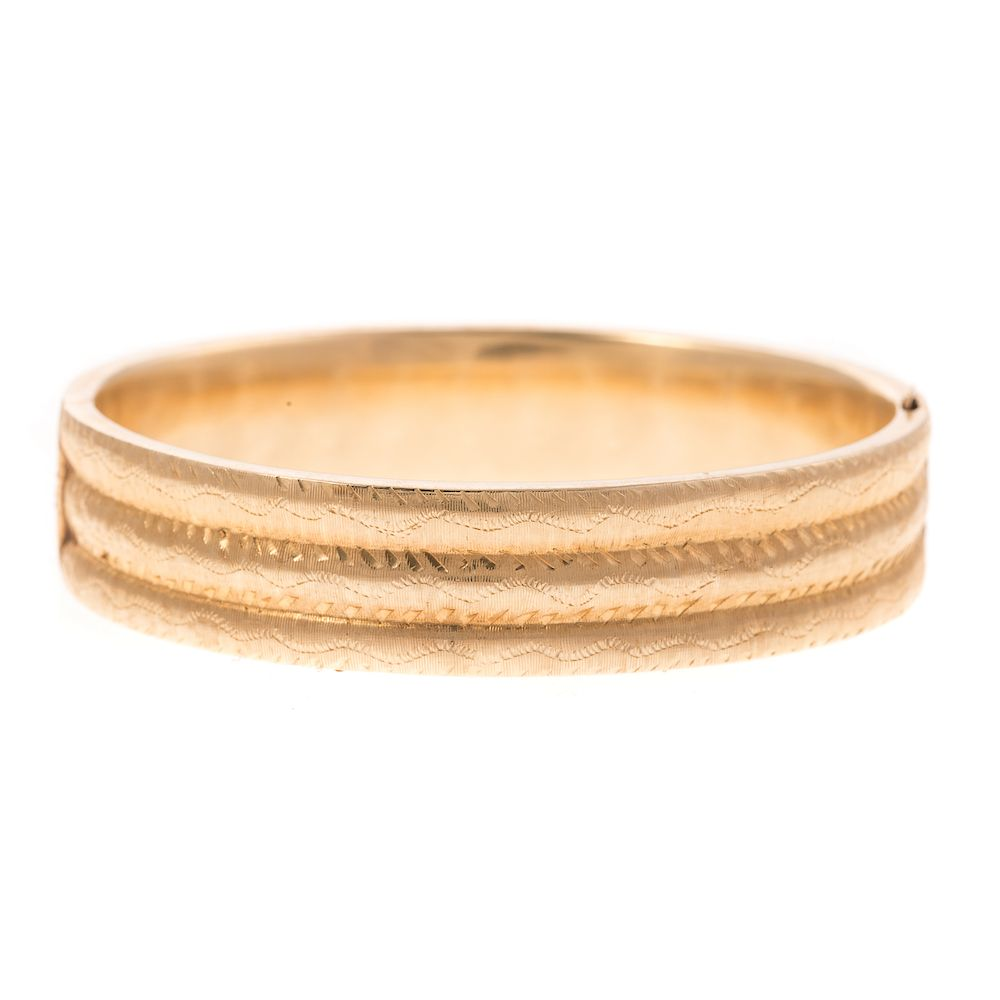 A Ladies Engraved Wide Bangle Bracelet in 14K 14K yellow