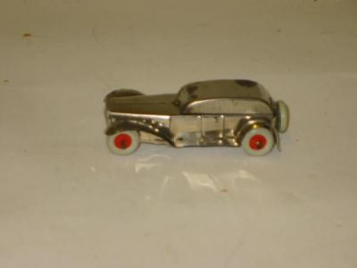 A novelty town car pencil sharpener plated tin construction with