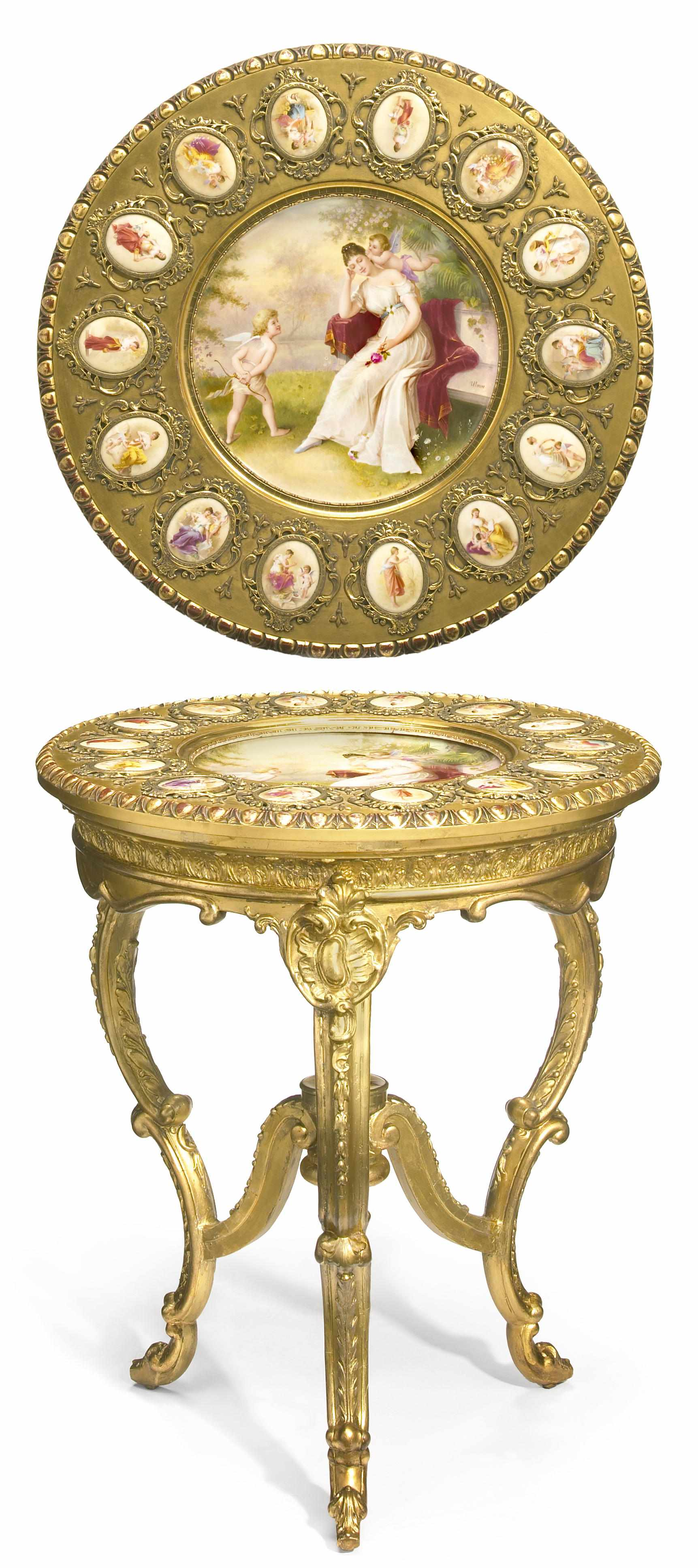 A Vienna style porcelain gilt metal mounted and carved giltwood