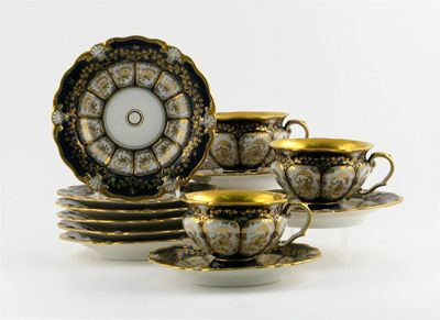 Twelve Berlin KPM teacups and saucers decorated with stylized gilt