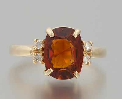 A Ladies Garnet and Diamond Ring 14k yellow gold ring