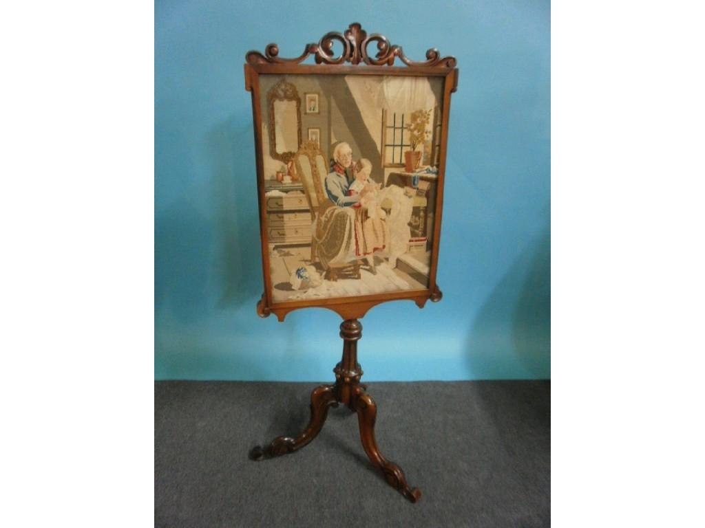 A Victorian rosewood fire screen the rectangular banner with a