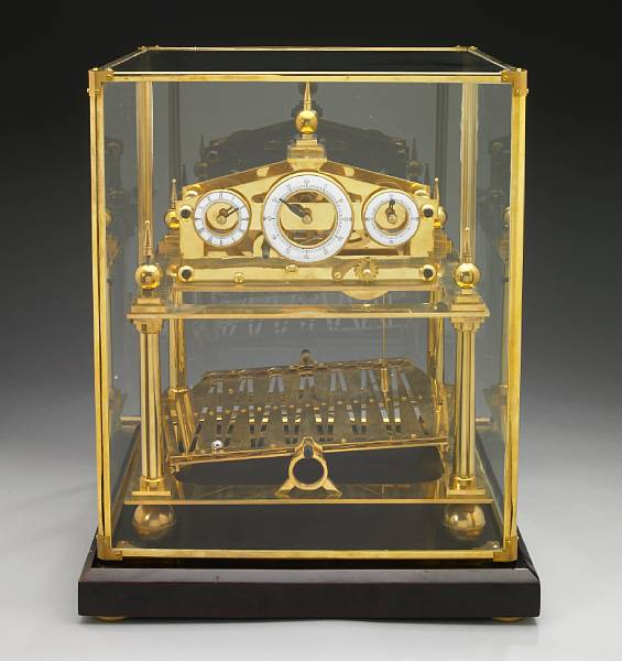 A brass rolling ball timepiece after a design by Sir