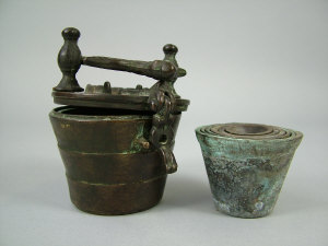 An Asian bronze nest of seven weights the hinged lid