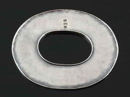 A handcrafted silver oval bangle by Roy Lewis The elongated