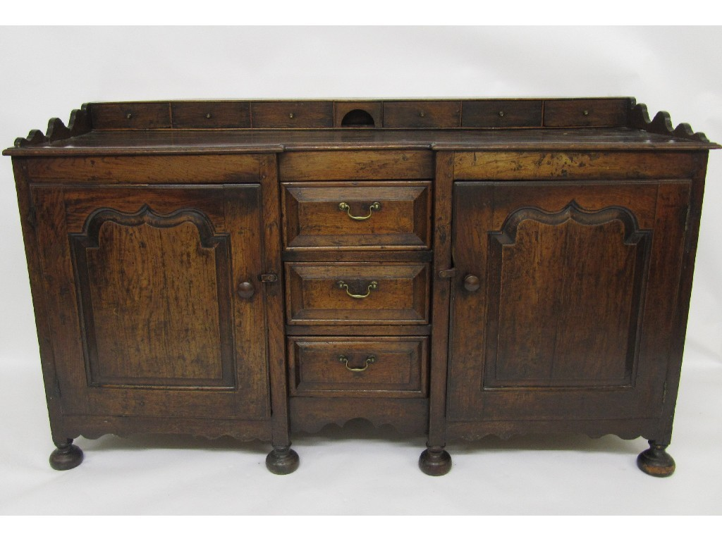 An 18th Century oak dresser the galleried back with six