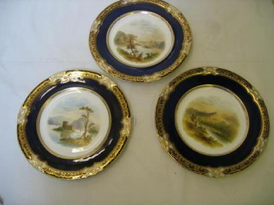 A SET OF THREE COALPORT CHINA PLATES of circular form