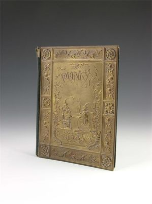A Punch gilt brass and leather blotter the cover decorated