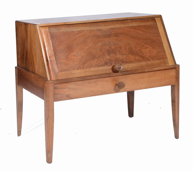 A LOW PALE WALNUT COTSWOLD SCHOOL BUREAU fitted with rising