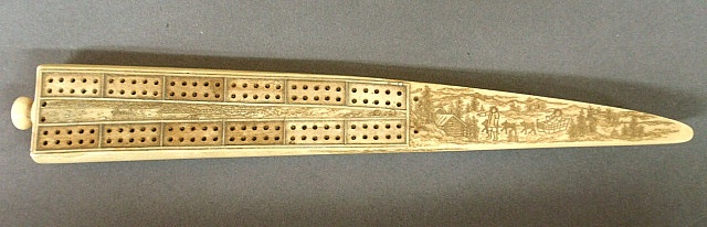 Walrus scrimshaw cribbage board 19th c with dog sled and