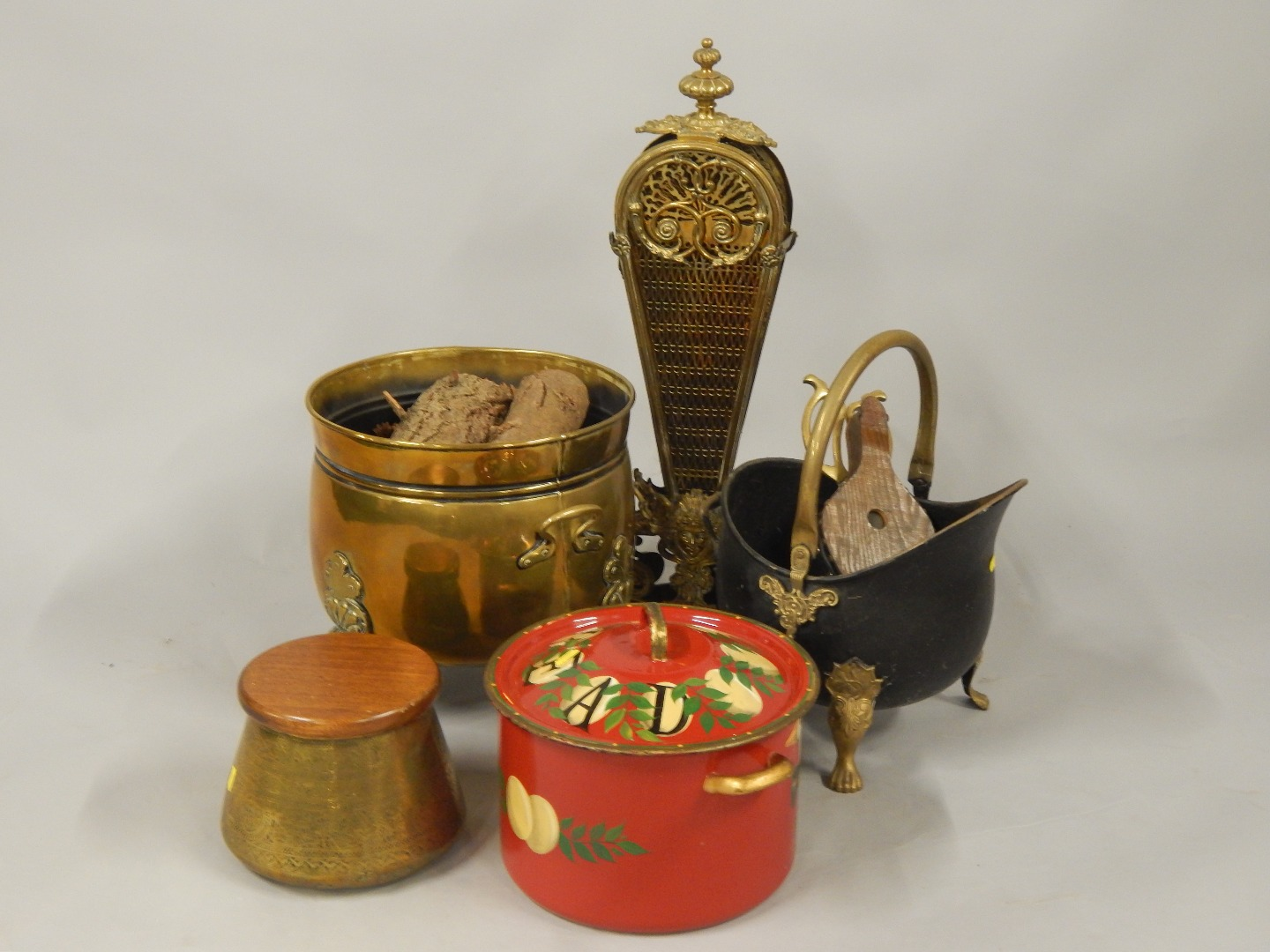 A brass log basket Middle Eastern brass bowl with wooden