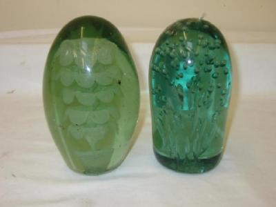 A VICTORIAN GREEN GLASS DUMP of ovoid form with flower