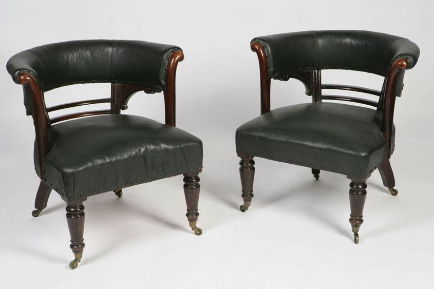 A PAIR OF VICTORIAN HORSESHOE SHAPED LIBRARY CHAIRS with upholstered
