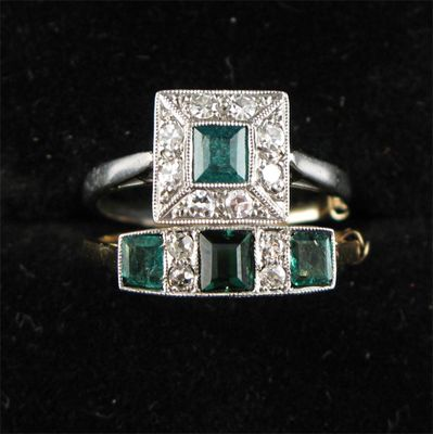 RING A square emerald and diamond cluster ring And a