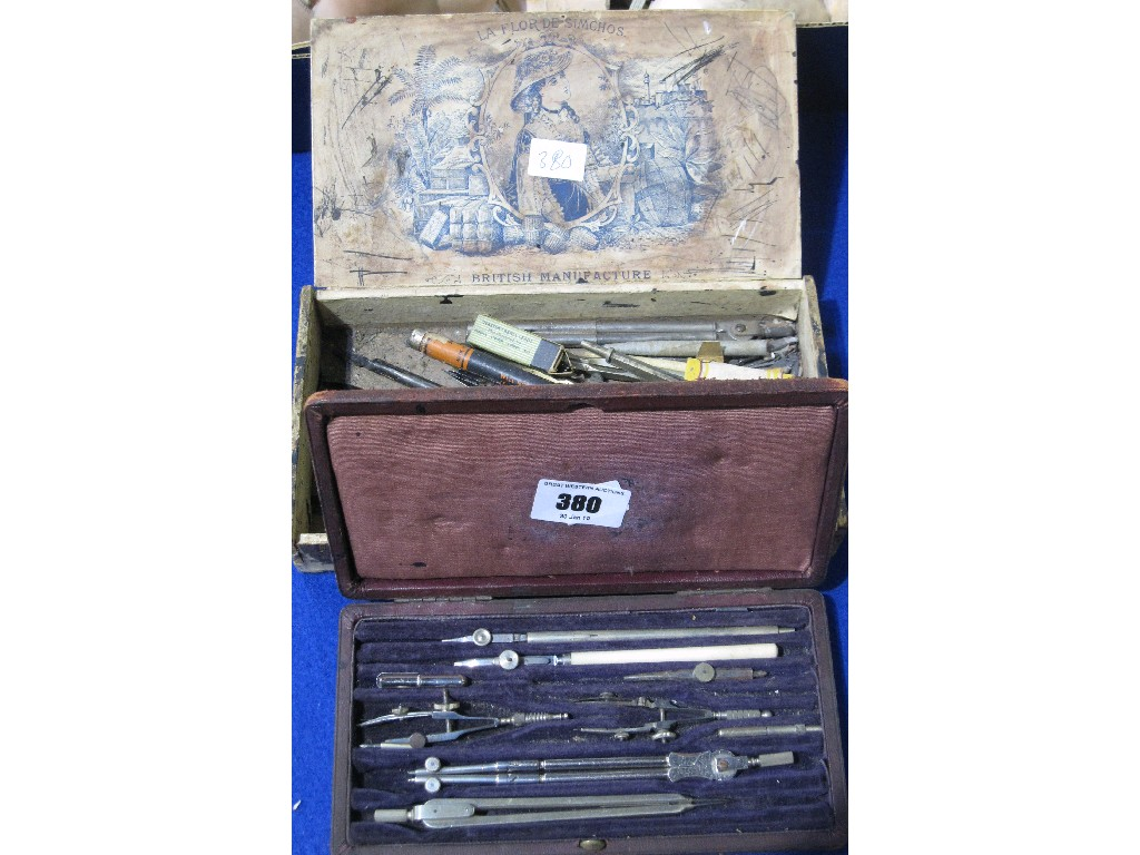 Lot comprising set of drawing instruments and a box of