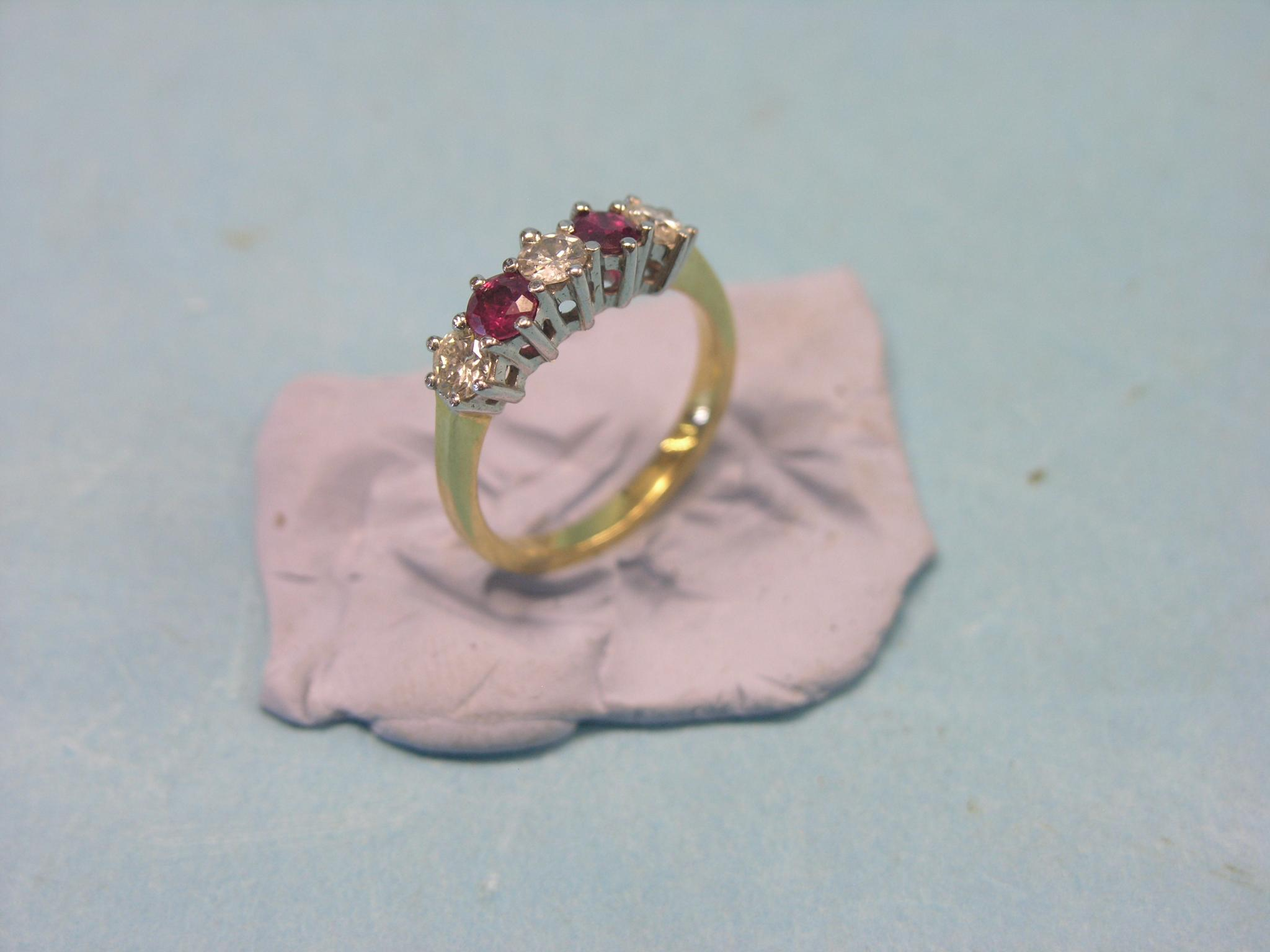 An 18ct gold half hoop ring three diamonds two rubies