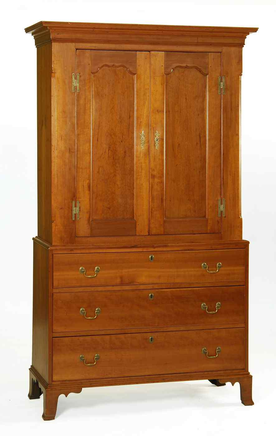 ANTIQUE AMERICAN HEPPLEWHITE TWO PART PRESS CABINETCirca 1800In cherry Upper