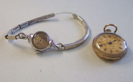 A ladies white gold and diamond set Elgin wristwatch detailed