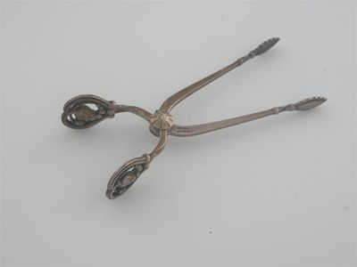 By Georg Jensen a pair of modern Danish sugar nips
