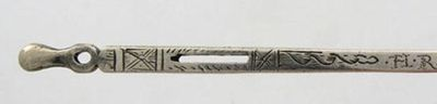 A late 17th century silver bodkin tapering circular form engraved