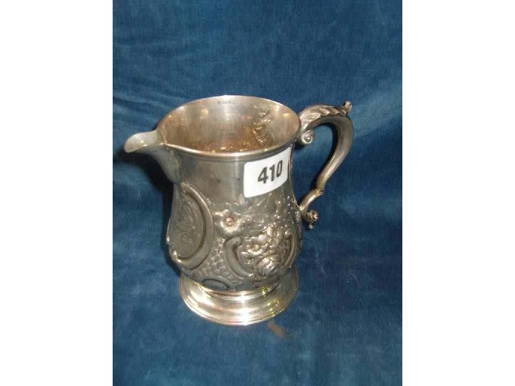 A Victorian silver pint tankard with loop handle pouring spout