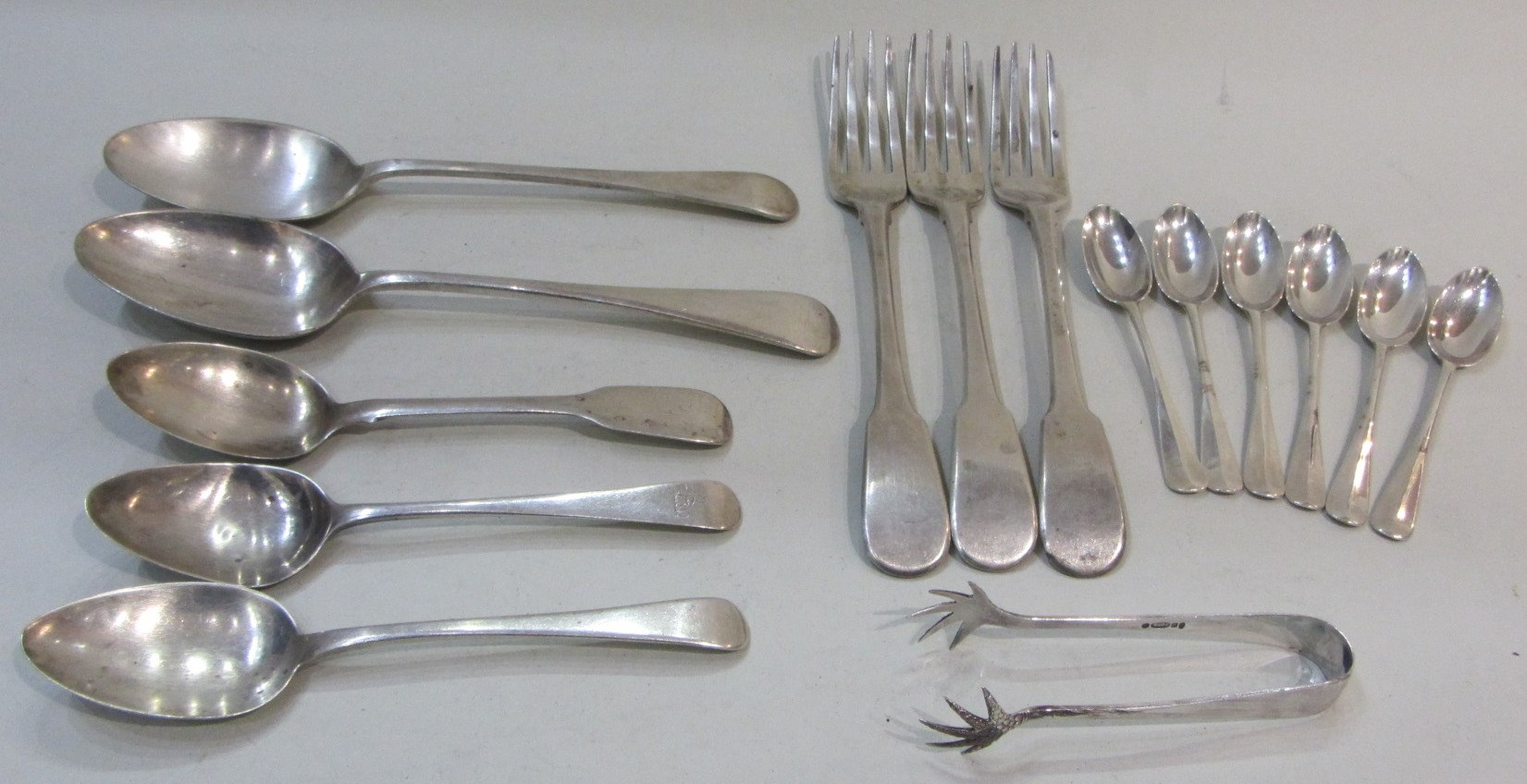 Silver table flatware comprising three fiddle pattern table forks London