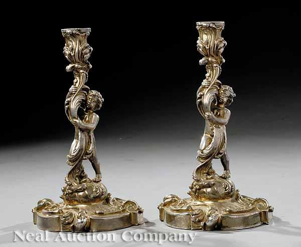 A Pair of Silvered Bronze Figural Candlesticks 20th c in